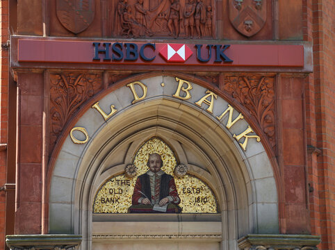 Stratford-upon-Avon, Warwickshire, England, UK. 15 May 2018. Mosaic tile feature depicting Shakespeare  above the front door to an HSBC bank.