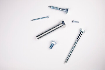 Bolts, self-tapping screws on a white background. Tools on white background
