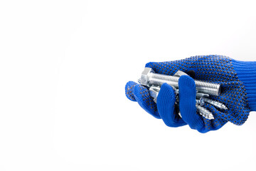 Hand squeezes tools on a white background. Hand in a glove on a white background. Bolt and screws in the palm of your hand. Man shows tools