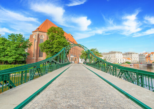 Wroclaw, Poland - crossed by the Oder River, Wroclaw displays a large number of colorful bridges, which are a main landmark of the town. Here in particular a typical iron bridge