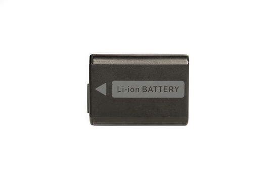 Black plastic lithium ion rechargeable battery on white background for mirrorless camera, dslr, image stabilizer or reflex camera. With the letters in gray.