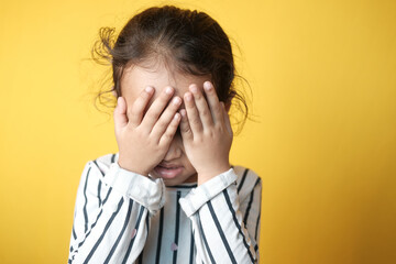 a upset child girl looking down 