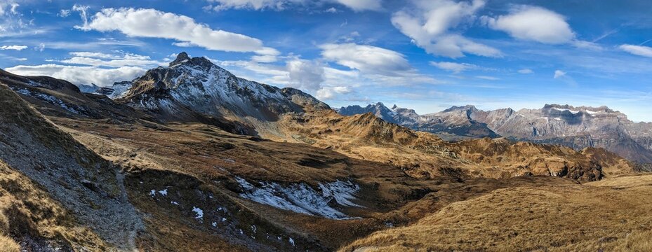 Mountain landscape picture in the Glarus Alps. View of the Charpf near Elm and the Leglerhutte. hiking in autumn. Snow