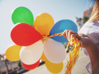 Family with balloons outdoors