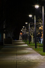 Sidewalk at night with lights 