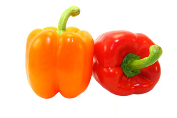 red and оrange peppers isolated on white