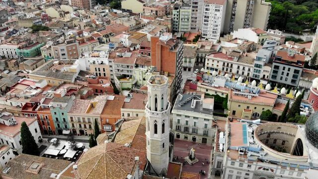 Drone shot Dali Theater-Museum. Drone view of the museum of the surrealist artist Salvador Dali, in Figueres, Catalonia. Esgl&eacute;sia de Sant Pere. Figueres city from above. Panoramic view from drone