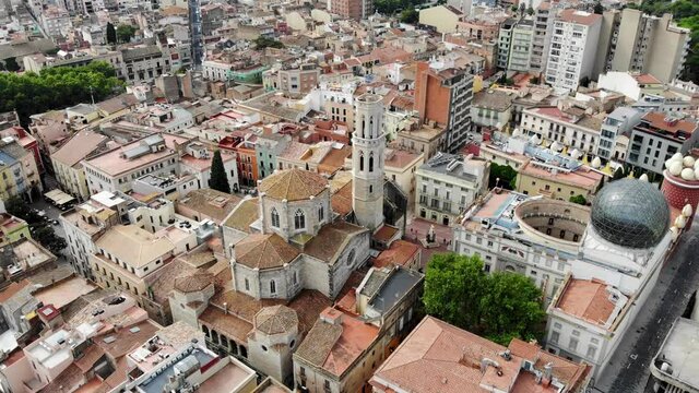 Drone shot Dali Theater-Museum. Drone view of the museum of the surrealist artist Salvador Dali, in Figueres, Catalonia. Esgl&eacute;sia de Sant Pere. Figueres city from above. Panoramic view from drone