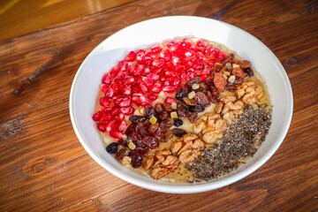 Oat porridge fruit. healthy breakfast nuts and fruits.