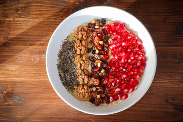 Oat porridge fruit. healthy breakfast nuts and fruits.
