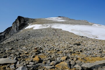 Beautiful mountain view of Jotunheimen National Park, on trail to summit Galdhopiggen 
in little snowy conditions. Norway, 
Scandinavia