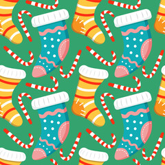 Seamless Christmas background with Christmas Knitted Socks with Patterns and candy cane striped