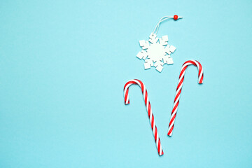 Christmas composition of lollipops and decorations in the form of snowflakes. The concept of the New Year