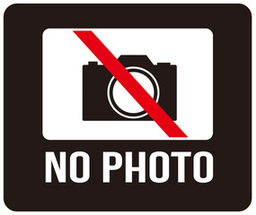 A sign that says : NO PHOTO