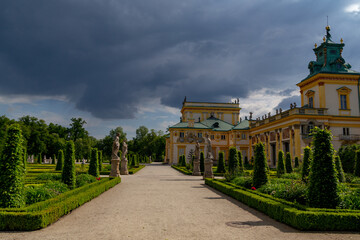 beautiful royal garden of  Willanow Palace in english style with antique statues Warsaw Poland