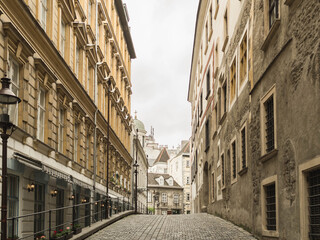 Old town in Europe with a narrow cobbled street and old architecture