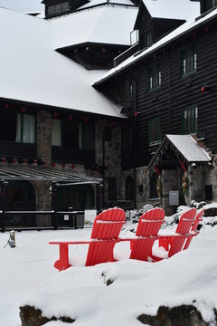 Red Muskoka Chairs In Winter