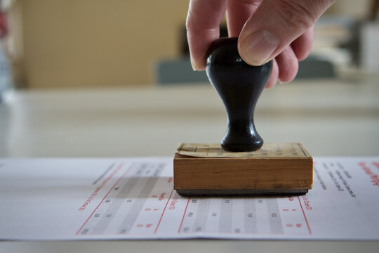 Document being rubber stamped