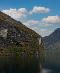 Fototapeta na wymiar A view of the majestic Geirangerfjord in the municipality of Stranda in the More og Romsdal region of Norway
