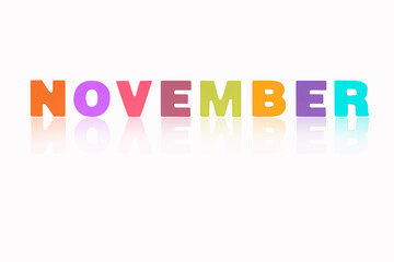 NOVEMBER month English made of wood  isolated on white background. Colorful wooden english alphabets set sort. letter made of wood arrange alphabet as categorize word. Poster banner design.