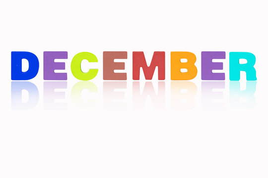 DECEMBER month English made of wood  isolated on white background. Colorful wooden english alphabets set sort. letter made of wood arrange alphabet as categorize word. Poster banner design.