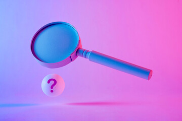 Magnifying glass floating above a sphere with question mark