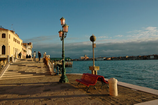 The Zattere promenade in Venice Italy. In the background the island of Giudecca on a sunny day