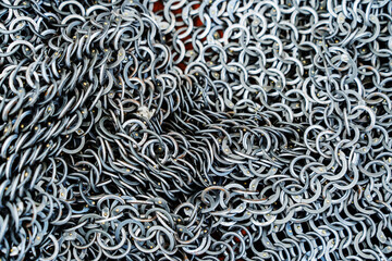 Fragment of medieval chain mail. A means of protection for ancient warriors made of metal rings and...
