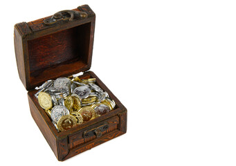 Antique box with a slightly open lid. Silver and gold coins are visible inside