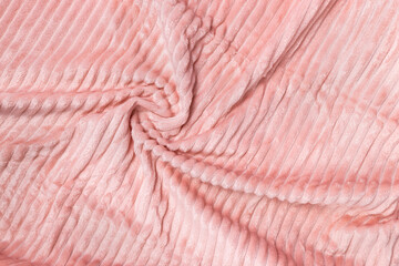 Soft pastel pink fleece throw fabric with lines. Texture for cozy winter background