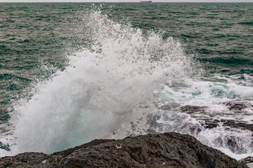 waves crashing on rocks