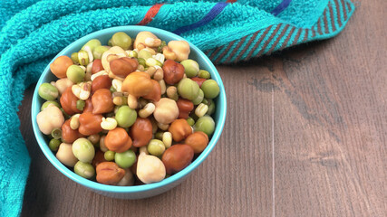 Healthy diet and vegetarian food. Mix of fresh sprouts on beautiful background. macrobiotic food. Sprouted wheat, peas, lentil seeds. Copy space 