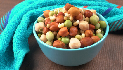 Healthy diet and vegetarian food. Mix of fresh sprouts on beautiful background. macrobiotic food. Sprouted wheat, peas, lentil seeds. Copy space 