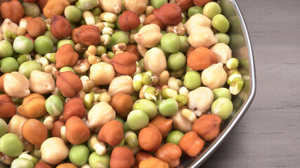 Healthy diet and vegetarian food. Mix of fresh sprouts on beautiful background. macrobiotic food. Sprouted wheat, peas, lentil seeds. Copy space 