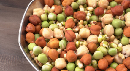 Healthy diet and vegetarian food. Mix of fresh sprouts on beautiful background. macrobiotic food. Sprouted wheat, peas, lentil seeds. Copy space 