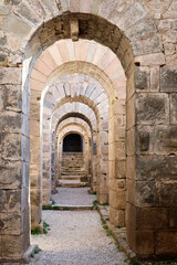 beautiful ancient old stone arch corridor in the ruins of Pergamon city in Turkey