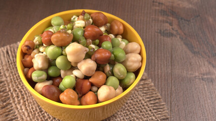 Healthy diet and vegetarian food. Mix of fresh sprouts on beautiful background. macrobiotic food. Sprouted wheat, peas, lentil seeds. Copy space 