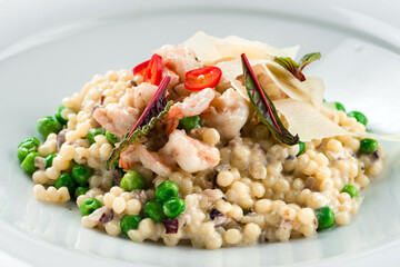 italian risotto with shrimps on white plate