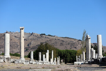 Fototapeta premium scenic view from sanctuary of asclepius to the majestic acropolis with steepest ancient theatre in the world, ruins of Pergamon, Turkey