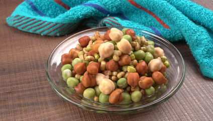 Healthy diet and vegetarian food. Mix of fresh sprouts on beautiful background. macrobiotic food. Sprouted wheat, peas, lentil seeds. Copy space 
