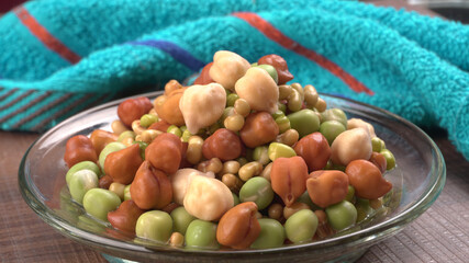 Healthy diet and vegetarian food. Mix of fresh sprouts on beautiful background. macrobiotic food. Sprouted wheat, peas, lentil seeds. Copy space 
