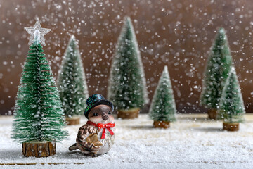 Holiday ceramic small bird and fir trees