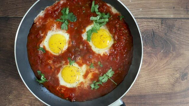 Closeup of Poached Eggs in Tomato Sauce
