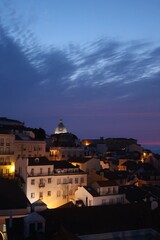 Cityscape Image of Lisbon, Portugal during dramatic sunrise.