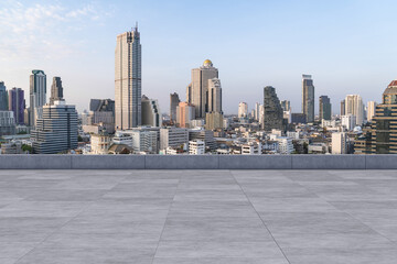 Obraz premium Panoramic Bangkok skyline view, concrete observatory deck on rooftop, daytime. Luxury Asian corporate and residential lifestyle. Financial city downtown, real estate. Product display mockup empty roof