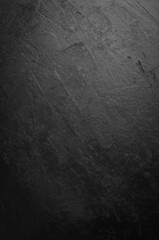Black stone background. Black surface. Top view. Free space for your text.