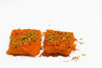 Selective focus of Syrian cuisine dessert Knavea Nabulsiya, a famous Kunafa with cream and cheese...