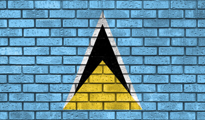 Saint Lucia flag on a brick wall