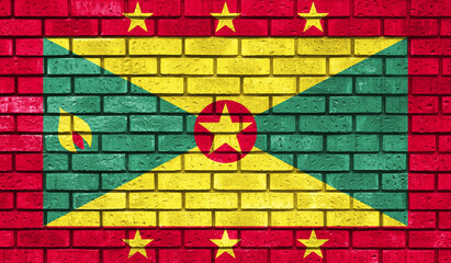 Grenada  flag on a brick wall
