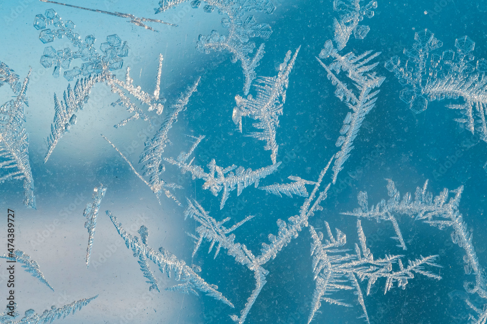 Aufkleber snowflakes on a window. macro shot